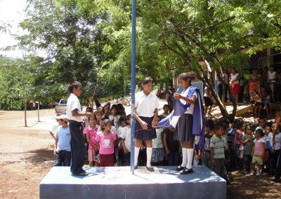 Children raising the flag pole